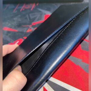 Black leather wallet with cross design